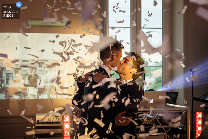 A France documentary wedding photographer captured this moment of confetti at the Place of reception A France documentary wedding photographer captured this moment of confetti at the Place of reception