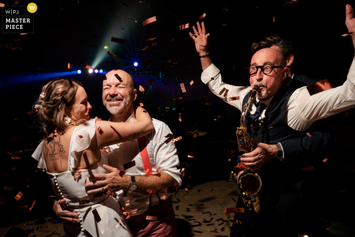 A top documentary wedding photographer from Pau France created this image of a Dancing moment at the reception with a sax