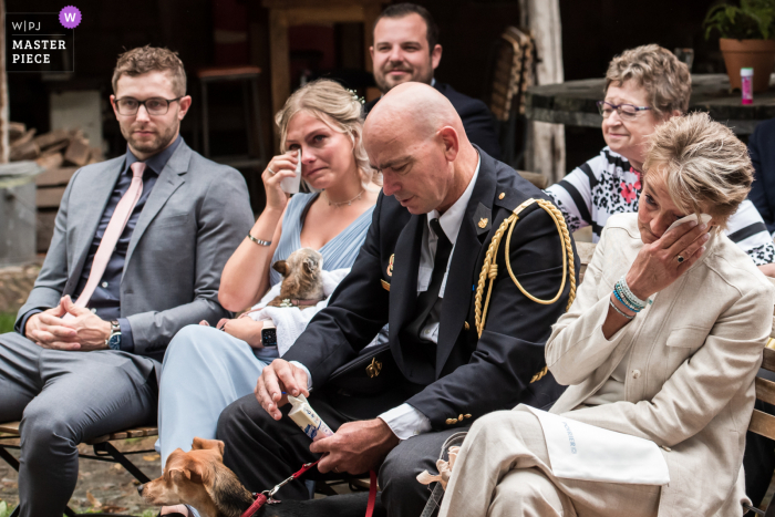 View this emotional, powerful Raamsdonksveer wedding image at De Stek venue capturing the brides parents and sister are very emotional during the ceremony