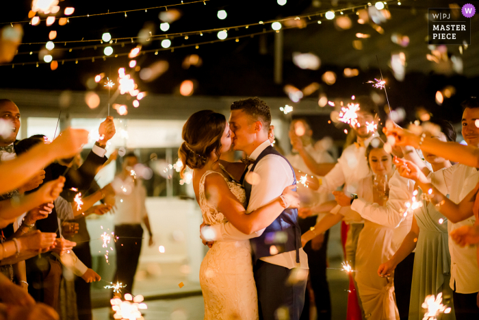 A top wedding photojournalist from Bulgaria created this image at the Orbita SPA Hotel of the couples sparkler exit