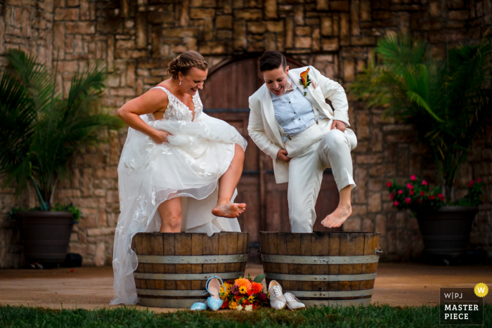 Brittany Diliberto, of Virginia, captured this wedding photo Two brides stomping grapes on their wedding day at Potomac Point Winery, Stafford VA Brittany Diliberto, of Virginia, captured this wedding photo Two brides stomping grapes on their wedding day at Potomac Point Winery, Stafford VA