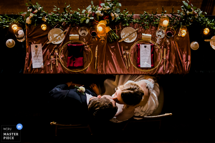 Best Kansas City wedding photojournalism picture of the Bride and Groom Kissing