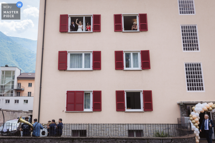 A Bellinzona wedding image from Ticino, Switzerland captured the band playing at the house of the bride 