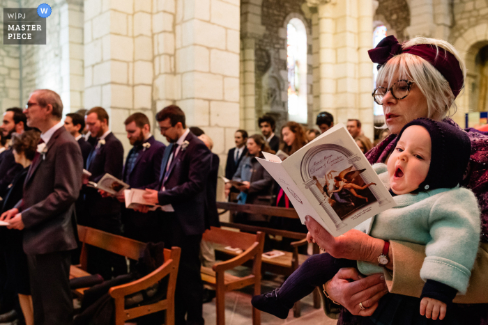 Nouvelle Aquitaine based wedding church photography of the grand mother with a son of bride