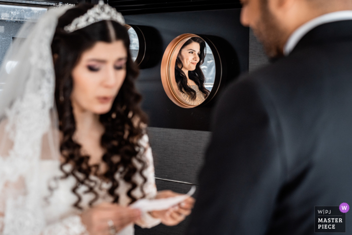Documentary photography from a wedding venue in Paris, the Yacht Victoria, of a Bridesmaid smiling during the Brides speech Documentary photography from a wedding venue in Paris, the Yacht Victoria, of a Bridesmaid smiling during the Brides speech