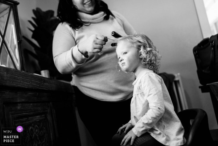 Best Santo Andre wedding venue photography in BW of a flower girl getting hair done