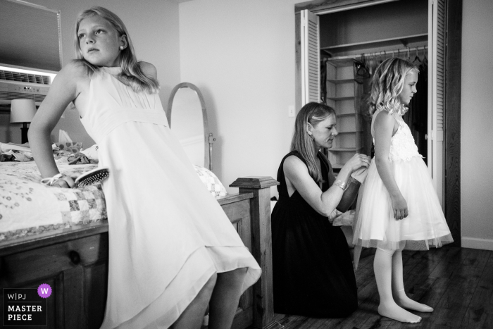 Montana editorial style wedding photography at St Ignatius showing two flower girls preparing for the day