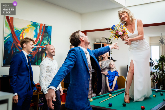 World class documentary wedding photography in Netherlands at home during the bride and groom first look 