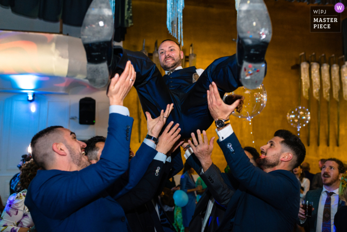 Jaen documentary wedding photography contest winning image at the Hotel ACG Los Villares of the groom and his time to fly 