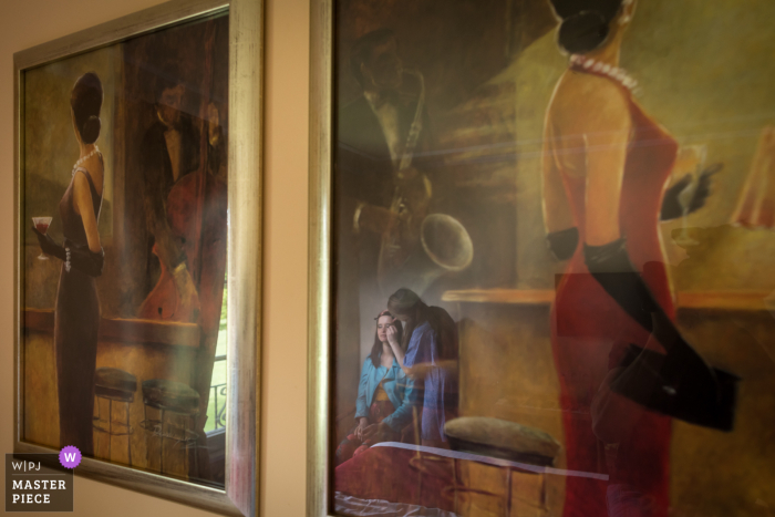 Strasbourg contest award winning documentary wedding photography in France from the hotel preparation session with the bride reflected in art glass Strasbourg contest award winning documentary wedding photography in France from the hotel preparation session with the bride reflected in art glass