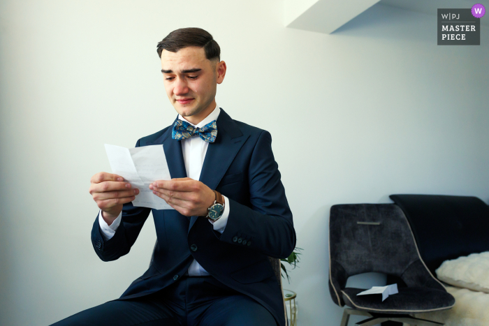 Love in Croatia: Emotional Moment Captured Before Vows Groom gets emotional while reading a heartfelt letter from his bride before their wedding in Slatina, Croatia.
