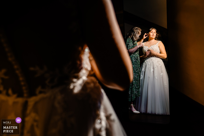 Bride Prepares for Big Day as Gelderland, Netherlands Brings Serenity to Beautiful Wedding As the bride takes a moment to reflect on the day ahead, the peaceful setting of Gelderland, Netherlands adds to the anticipation at this beautiful wedding.