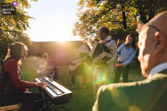 The groom showed off his accordion musical talents, joining his band to play some lively tunes for guests at his rustic wedding reception at Le Château des Broyers.