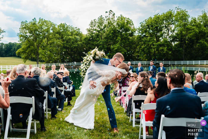 Love and Happiness at Bluestone Estate: Newlyweds Dip and Kiss into a Blissful Journey Love and bliss surround the newlyweds as they share a dip kiss and begin their journey together at the beautiful Bluestone Estate.