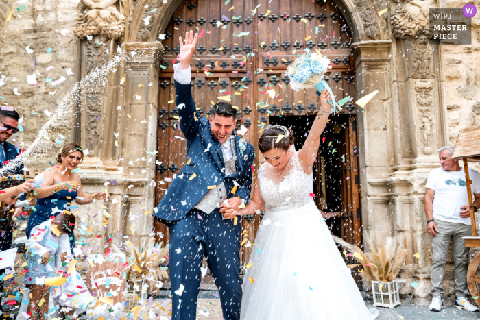 As the newlyweds walked out of the historic Iglesia de San Ildefonso in Jaén, Spain, it was time for the traditional rice tossing to commence in celebration of their marriage.