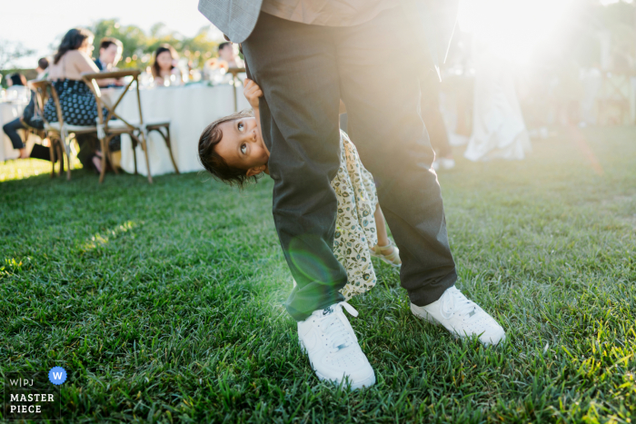A joyous moment as a father cherishes time with his daughter, captured beautifully at the Tuscan Rose Ranch by a CA WPJA wedding photographer.