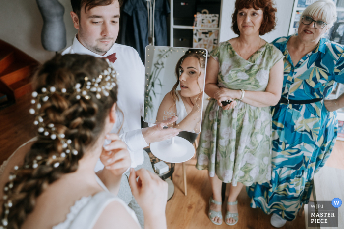 Preparing for the Wedding in Amiens, France: Family, Beauty, and Photography With the support of her family, the bride gets ready for her special day in Amiens, France, captured beautifully by a talented WPJA wedding photographer.