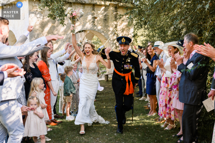Newlyweds Begin Happily Ever After at Château de Puissentut's Enchanting Garden Ceremony Happily ever after begins in the charming gardens of Château de Puissentut, as the newlyweds are cheered on by loved ones under a canopy of trees and sunlight.