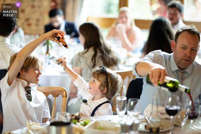 Children Frolic and Adults Enjoy Wine at Upwaltham Barns Reception The reception is in full swing at Upwaltham Barns, as the little ones frolic and the grown-ups relax with a delicious pour of red wine.