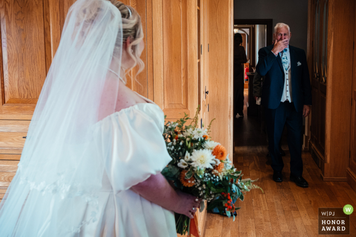 Dad Overwhelmed With Emotion Seeing Daughter in Wedding Dress at Swancar Farm At Swancar Farm, the father of the bride places his hand over his mouth, overwhelmed with emotion as he sees his daughter in her wedding dress for the first time.