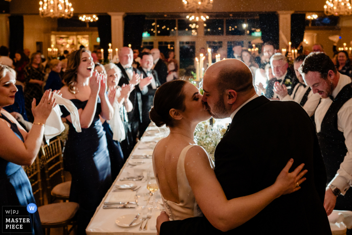 Newlyweds entered the Kilkea Castle’s grand dining hall in Kildare, Ireland, with a kiss and greeted by guests, celebrating their wedding dinner.
