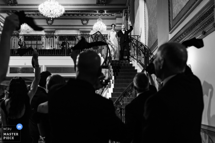 At Vault 634, the bride and groom make their grand entrance into the reception. The award-winning photo highlights the photographer's skill at documenting the energetic moments of a wedding.