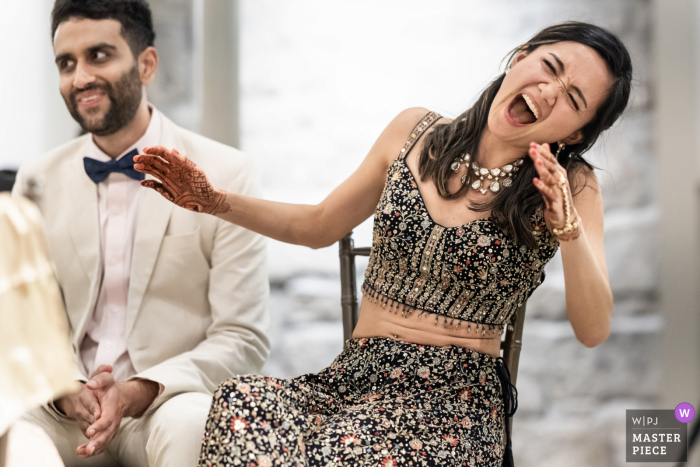 Joy Radiates As The Bride Listens To Her Sister’s Speech During The Reception At Greystone At Piedmont Park, Atlanta. At Greystone at Piedmont Park, Atlanta, the bride listens, reacting emotionally with joy to a memorable speech delivered by her sister during the reception.