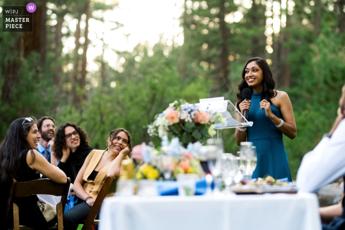   At Valhalla Estate in South Lake Tahoe, CA, a toaster joins the guests in sharing a fun, quirky moment during the lively wedding reception.