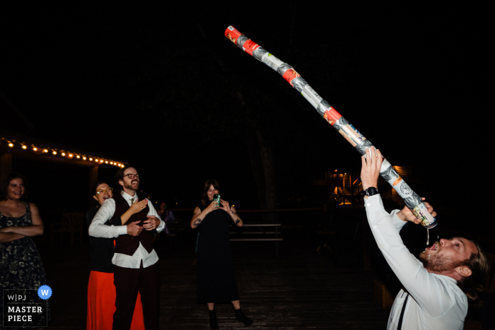   Drinking games bring laughter and friendly competition to the celebration at Northfork, Idaho, as guests cheer each other on and share in the festivities.