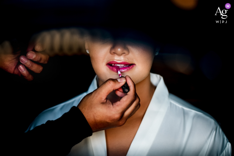 The Ritz Dubai wedding photo of the bride doing her Lipstick The Ritz Dubai wedding prep photography with the bride and her Lipstick