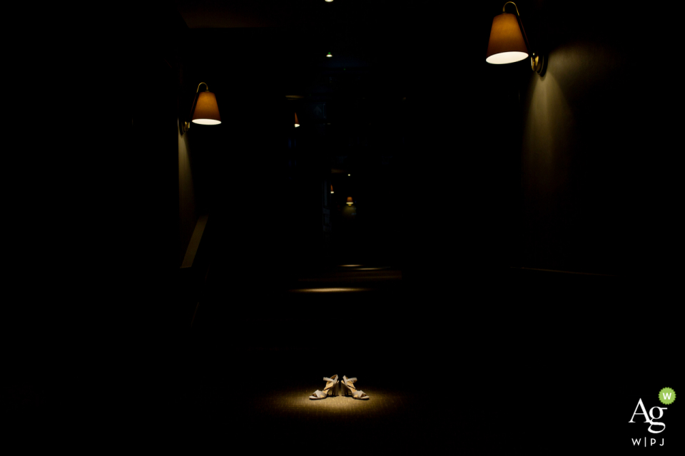 Photo by: <a href="https://www.wpja.com/photos/artistic-wedding-photographers/2617124">Martin Dabek - Bristol Bristol Avon Gorge, Hotel du Vin wedding detail picture by Bristol wedding photographer "I noticed dramatic light on the hotel corridor next to the bridal suite, so I pleased bride's shoes under the spotlight"