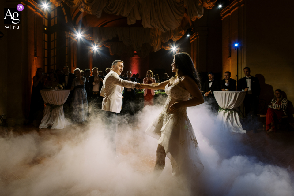 A couple was seen twirling around the illuminated and foggy Dancefloor at the Chateau de Vallery At the Chateau de Vallery, a couple is dancing on a nice Dancefloor with lights and fog