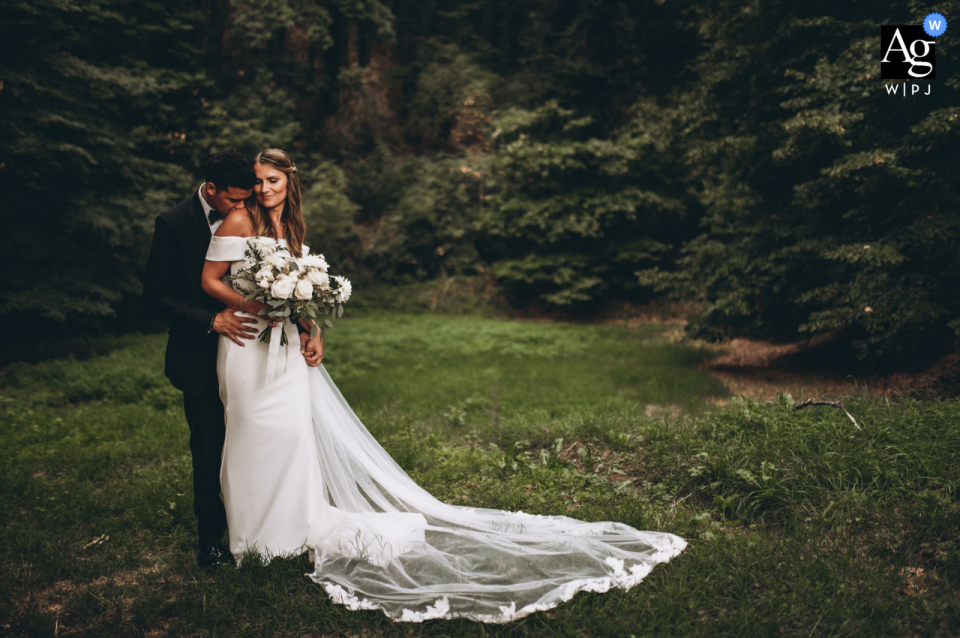A Tuscany wedding photographer captured a stunning portrait session on a grassy lawn in the countryside, providing a beautiful texture to the couple's special day