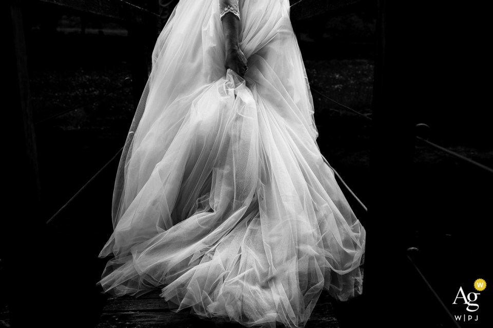 The black and white image of the bride's dress detail from the back of the Antico Casale Urbani in Spoleto, Italy, is a masterpiece