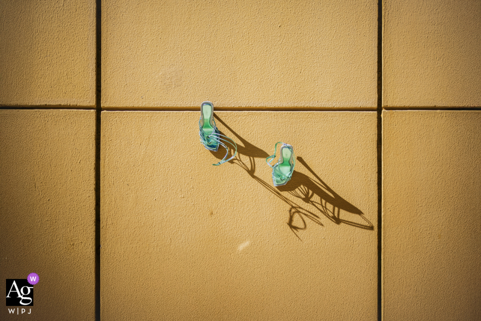 At Mersin Hilton Hotel, the wedding shoes are captured in harsh light, emphasizing their design and details with striking shadows and highlights.