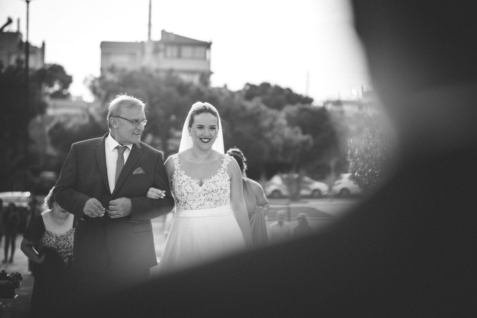 Photo of the bride and father walking down the aisle in Vari, Athens, Greece Vari, Athens, Greece bride and father walking down the aisle