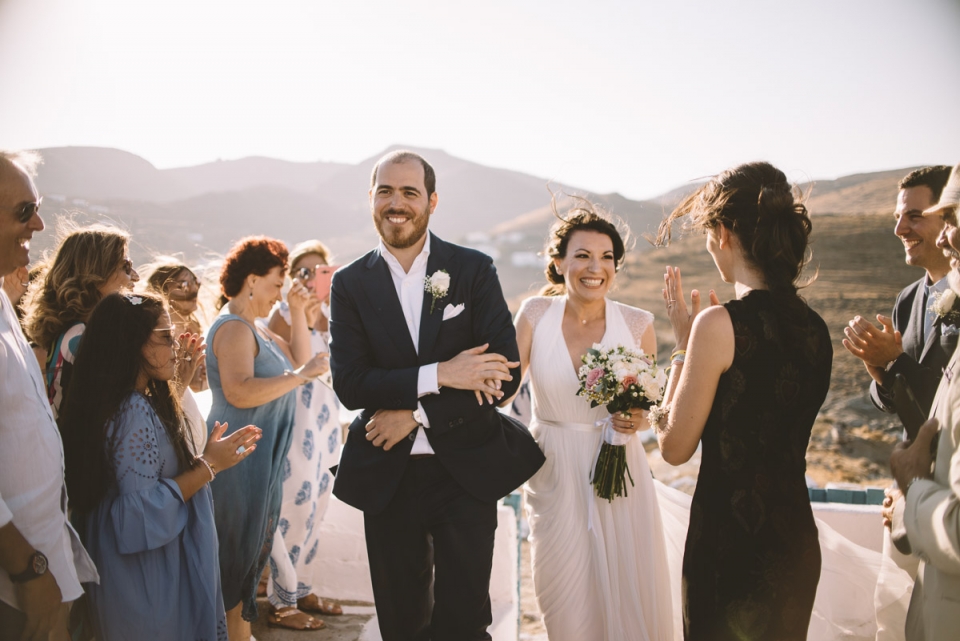 bride and groom walking down the aisle in Kythnos, Greece Photo of a Kythnos, Greece bride and groom walking down the aisle