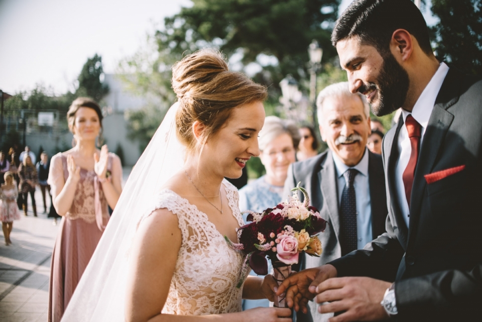 Chalkida, Greece Ktima Boureli wedding photographer Chalkida, Greece Ktima Boureli wedding photography of the bride and groom with bouquet of flowers.