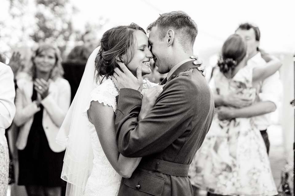 Bacton, Norfolk, UK wedding reportage photography for review letter Bacton, Norfolk, UK wedding reportage image of bride and groom kissing