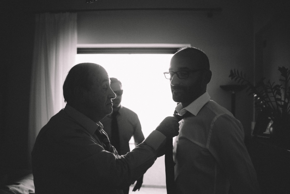 Photography of groom preparation - father making up the tie in Athens, Greece Athens, Greece groom preparation photography.