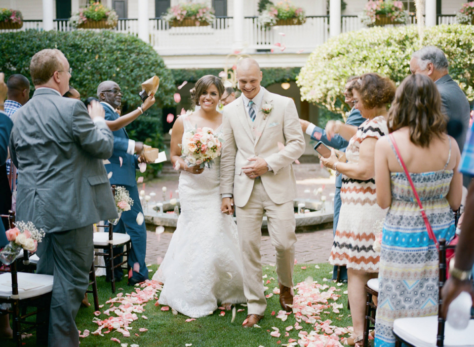 Charleston, SC outdoor wedding picture of the bride and groom leaving garden ceremony at the Governor Thomas Bennett House Governor Thomas Bennett House, Charleston, SC wedding image of bride and groom leaving outdoor garden ceremony