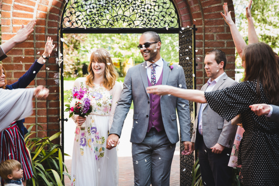 The Waterside, Rickmansworth, United Kingdom | Wedding Venue Photographer The Waterside, Rickmansworth, United Kingdom | Wedding image of the bride and groom under confetti showers