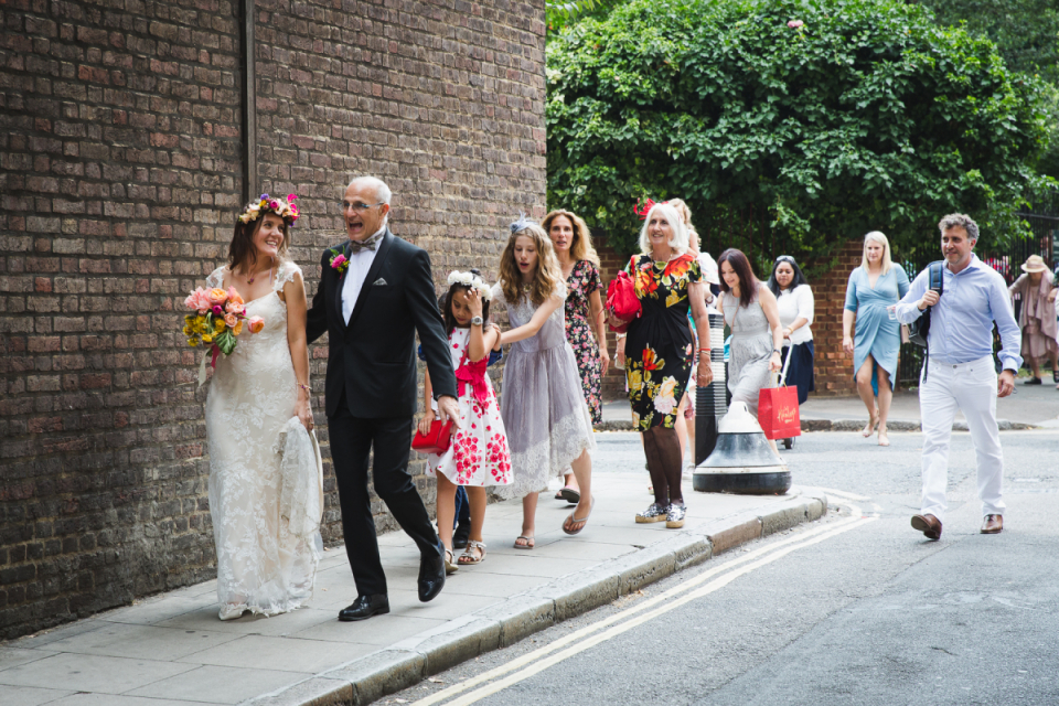 Phoenix Garden, London, United Kingdom | Wedding Venue Photography Image of the bridal party walking near the venue of Phoenix Garden, London, United Kingdom