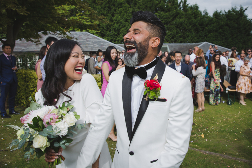 High House, Fillongley Warwickshire, United Kingdom | Wedding Venue Images Wedding photo of the bride and groom laughing after their outdoor ceremony at High House, Fillongley Warwickshire, United Kingdom