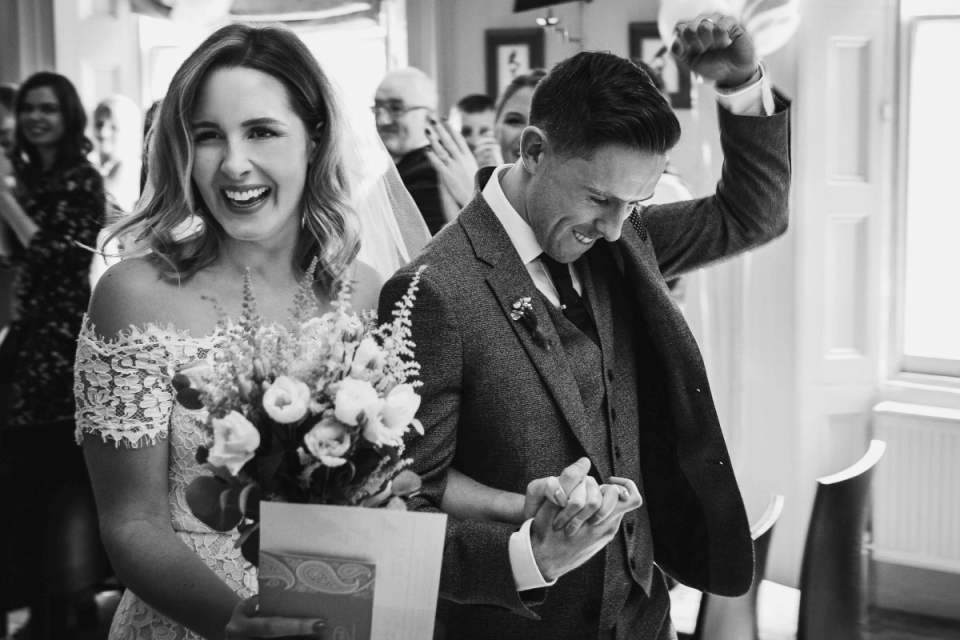 The Rosendale, West Dulwich, London | Wedding Venue Photographer Photo of the fist-pumping groom walking with the bride at The Rosendale, West Dulwich, London
