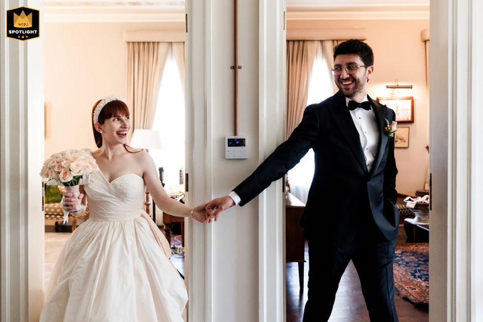 Couple Shares First Look, Reaching Hands Toward Each Other in Separate Doorways at The Marmara Esma Sultan in Istanbul, Capturing Anticipation At The Marmara Esma Sultan in Istanbul, the couple shares their first look, framed indoors in separate doorways. They reach a hand toward each other, capturing the anticipation before seeing each other.
