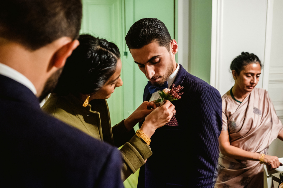 Cihangir, Istanbul, Turkey wedding photography by Ufuk Sarisen of the groom getting his flower pinned