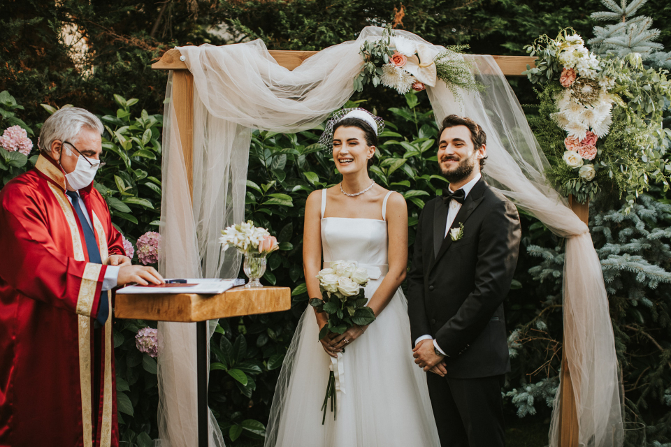 Bride and groom wedding ceremony image from an Istanbul, Turkey outdoor marriage - Images by Derya Engin