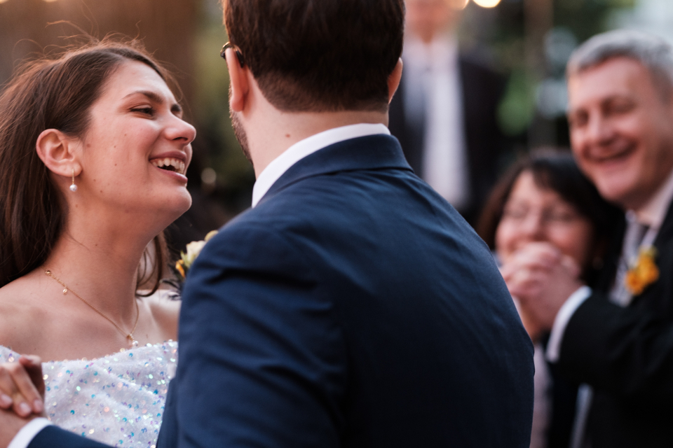 A backyard wedding image of the bride and groom dancing in Squirrel Hill, East End of Pittsburgh - Pennsylvania Elopement Photography by Kate Hagerty