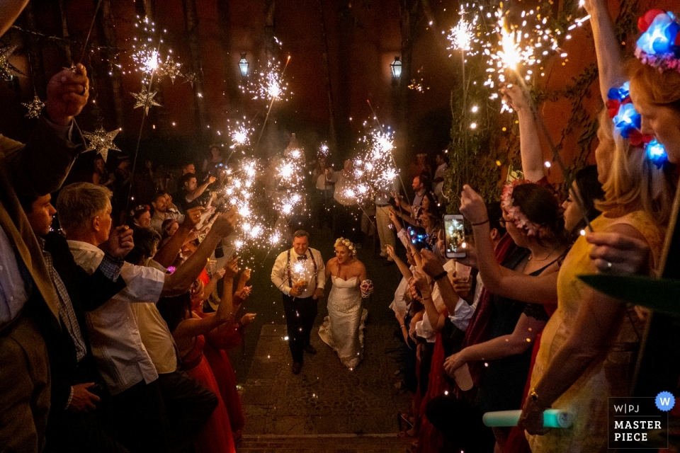 Photo by: <a href="https://www.wpja.com/contests/2019-v03-photography-competition/best-wedding-photographers/2460801">Brett Butterstein - Encinitas California</a> casa hyder, san miguel de allende, mexico wedding photography | the bride and groom exit their reception with sparklers